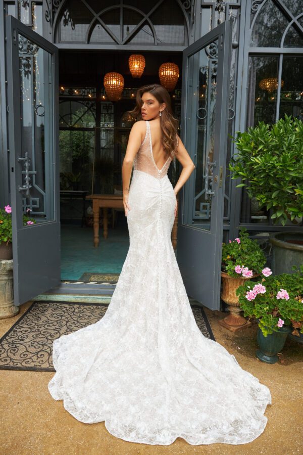 Martina Liana 1697 Wedding Dress - Fit and flare style dress with spaghetti straps, sequin lace side cut outs, visible boned bodice and open back.