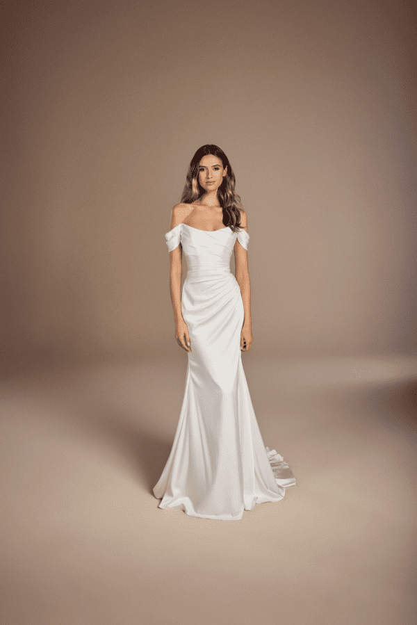 Suzanne Neville Degas Wedding Dress - Degas has a scoop neck corseted bodice with off the shoulder straps and a ruched fitted skirt in satin crepe.