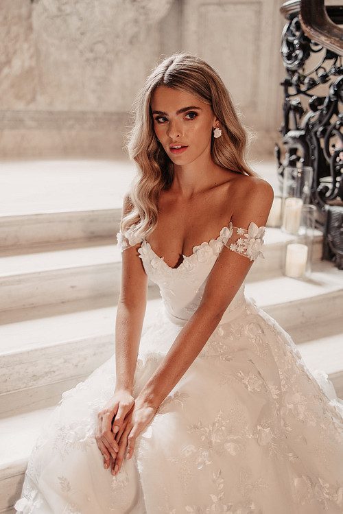 Suzanne Neville Debussy & Overskirt Wedding Dress - A - Line overskirt with a cupped corseted bodices and off the shoulder delicate sleeves in floral tulle.