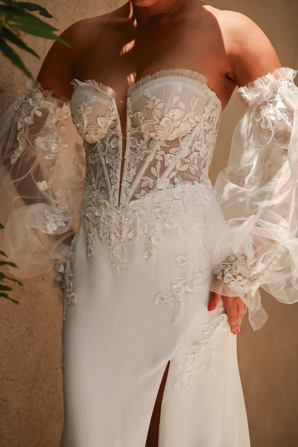 Martina Liana 1710 Wedding Dress - Fit and flare dress with strapless sweetheart neckline, bustier bodice exposes corset, hand placed lace appliqués.