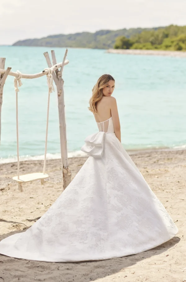 Paloma Blanca 2478 Wedding Dress Sample Sale - A Line style with strapless, plunging neckline, exposed boning, fabric belt, wrap skirt and pockets. 