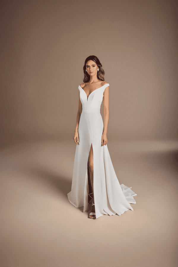 Suzanne Neville Bertali Wedding Dress - Off the shoulder wide v-neck corseted bodice with beautiful waist seaming and a flattering crepe skirt with split.