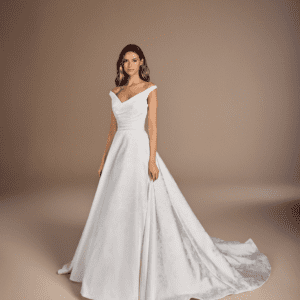 Suzanne Neville Ravelli Wedding Dress - Elegant off-the-shoulder v-neckline, with corseted bodice, full ball gown skirt, in Ravelli floral printed Mikado.