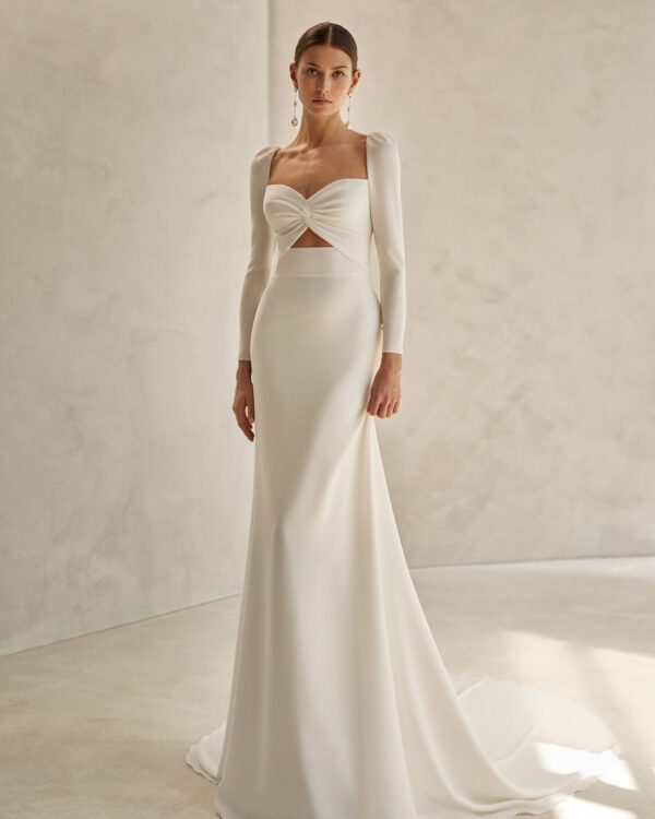 Rosa Clará Fortuna Wedding Dress - Fit and flare dress with a straight cut and sexy style, front knot, sweetheart neckline, teardrop back, and long sleeves.