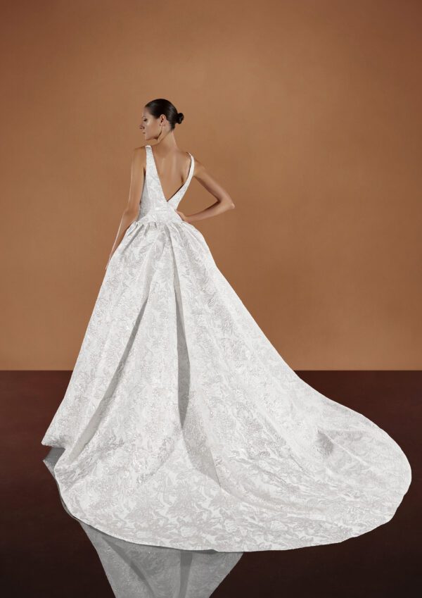 Pronovias Kareena Wedding dress - Ballgown style dress with a deep v-neckline, low waist, floral details all over, open back and train.