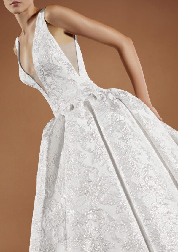 Pronovias Kareena Wedding dress - Ballgown style dress with a deep v-neckline, low waist, floral details all over, open back and train.