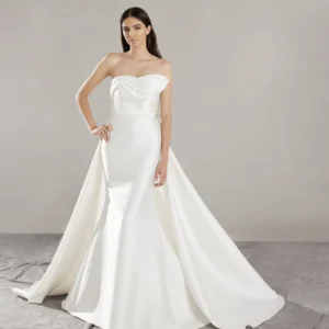 Pronovias Arya Wedding Dress - Mermaid style dress with strapless neckline, pleats and asymmetry detail, v-back and button placket.