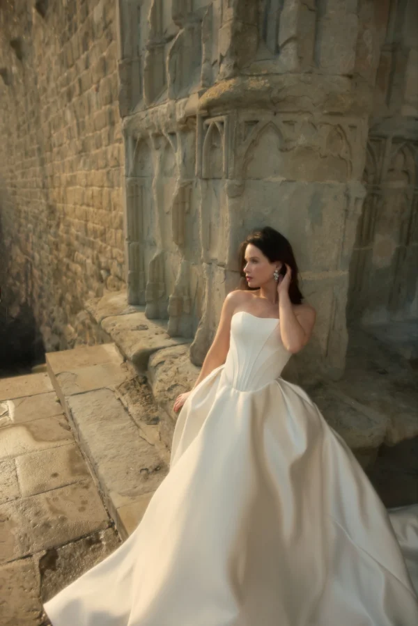 Enaura Jules Wedding Dress -  Ballgown with double-face satin, exposed corseted seams, delicate pleats accentuating the waist and hand-embroidered