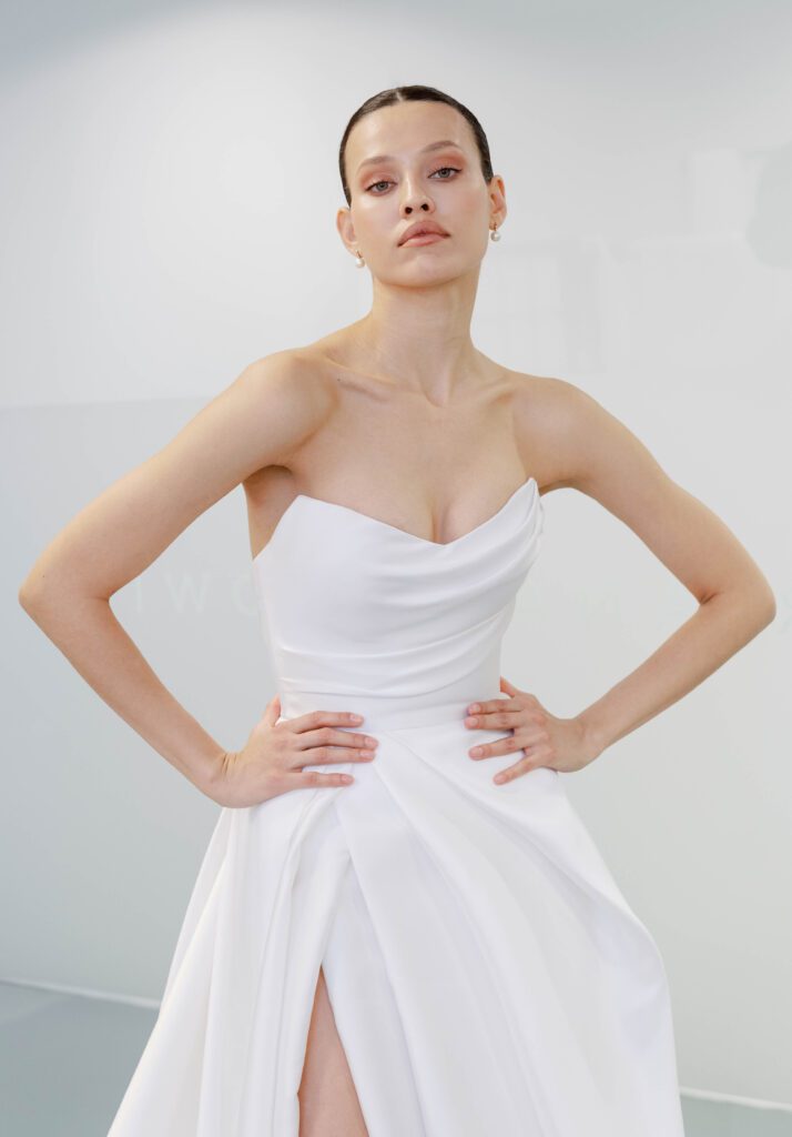 Mariana Hardwick Chantelle Wedding Dress - A-Line style dress with sweetheart neckline, draped bodice, layered side slit on skirt, off the shoulder straps.