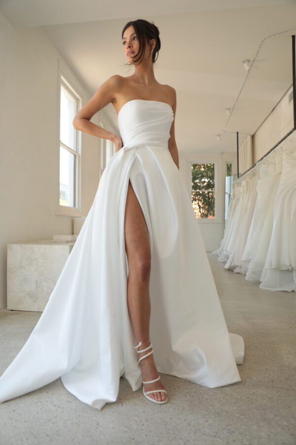 Mariana Hardwick Vivianne Wedding Dress - A-Line style dress with sweetheart neckline, draped bodice, layered side slit on skirt.