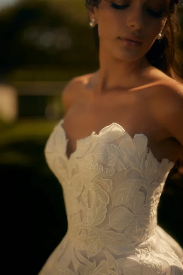 Enaura Florence Wedding Dress - Ballgown style dress with sweetheart neckline, organic hand-cut filigree detail. Botanical-inspired pattern.