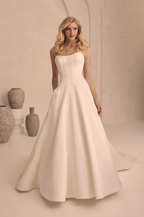 Paloma Blanca 2503 Wedding Dress - Strapless in duchesse satin, princess seams, scoop neckline, tulle, exposed boning, and cascading covered buttons.