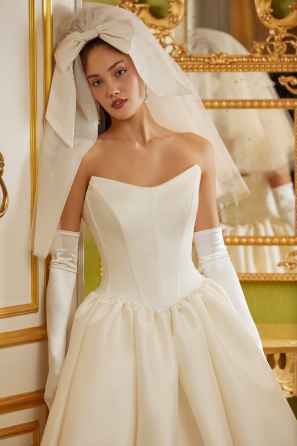 Sareh Nouri Park View Wedding Dress - Italian Mikado cat eye neckline basque waist pleated and gathered ballgown with signature bow accents on back bodice.