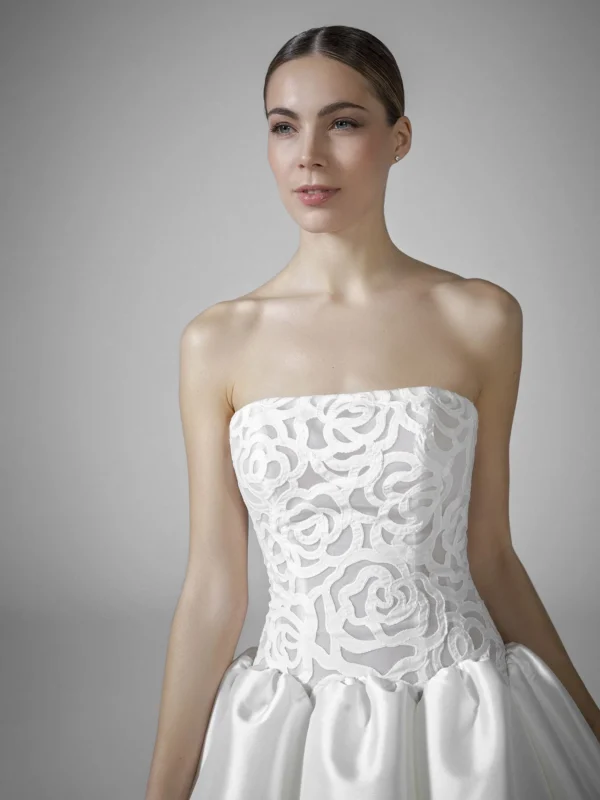 Pronovias Bourgeon Wedding Dress - Princess-cut Ballgown features a reinforced corset-style bodice with a strapless neckline and artistic rose motifs.