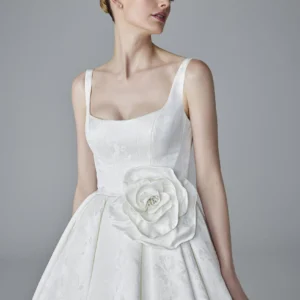 Pronovias Julian Wedding Dress - Structured Ballgown in Jacquard with strapless bodice, squared neckline, and princess skirt. Removable flower detail.