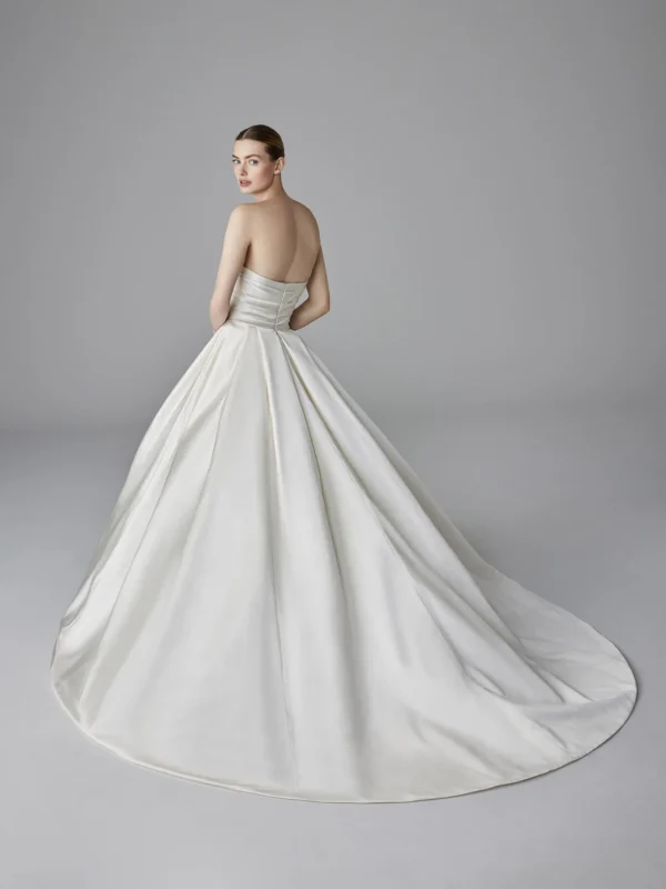 Pronovias Kristin Wedding Dress - Princess design in satin strapless bodice, pleated details on skirt, removable off the shoulder sleeves. 