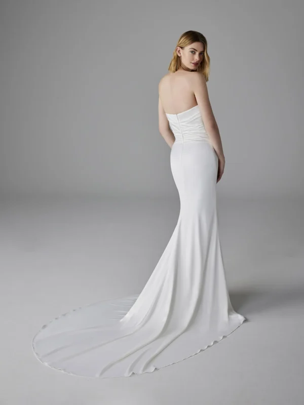 Pronovias Romentina Wedding Dress - Mermaid-Cut dress in satin fabric featuring sleeveless sweetheart neckline, side slit on skirt, and rhinestones details. 