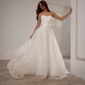 Suzanne Neville Miltonia Wedding Dress -Sweetheart neckline with fitted bodice, a beautiful flowing A-line skirt and a delicate silk ribbon belt.