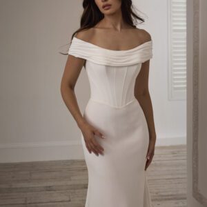 Suzanne Neville Duranta Wedding Dress - Fit and flare dress with off-shoulder bateau neckline, collar that extends around the back in a V and corset details