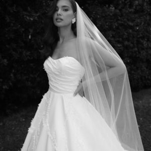 Strapless sweetheart neckline, asymmetrical fitted bodice, and 3D all over details.