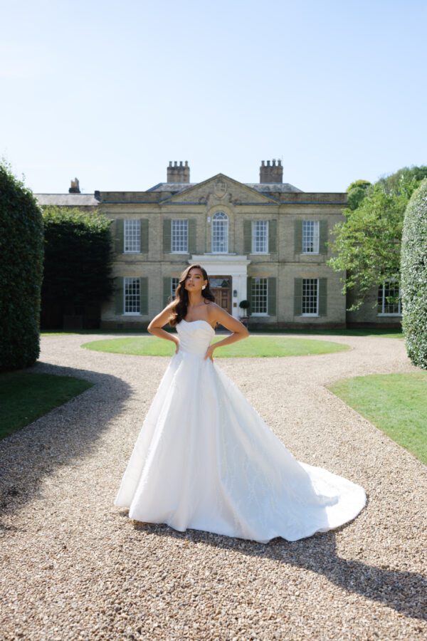 Strapless sweetheart neckline, asymmetrical fitted bodice, and 3D all over details.