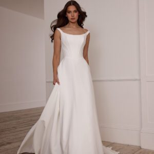 Suzanne Neville Fittonia Wedding Dress - A-Line style dress with low v waist, fitted corset bodice, bateau neckline, low v-back and covered buttons.