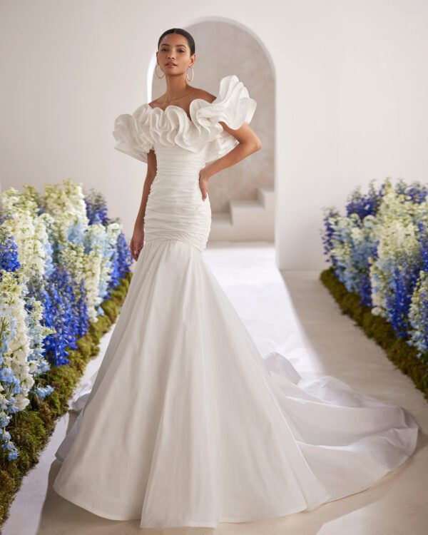 Rosa Clará Tanger Wedding Dress - Sexy mermaid wedding dress made in taffeta. Featuring a strapless neckline, flounced details and a draped bodice.