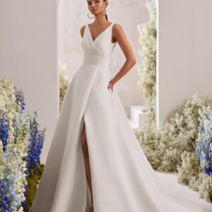 Rosa Clará Taori Wedding Dress - Elegant princess wedding dress crafted in cloqué. Featuring a V-neckline, V-back and straps. The pockets at the skirt, front slit and sash complete the look.