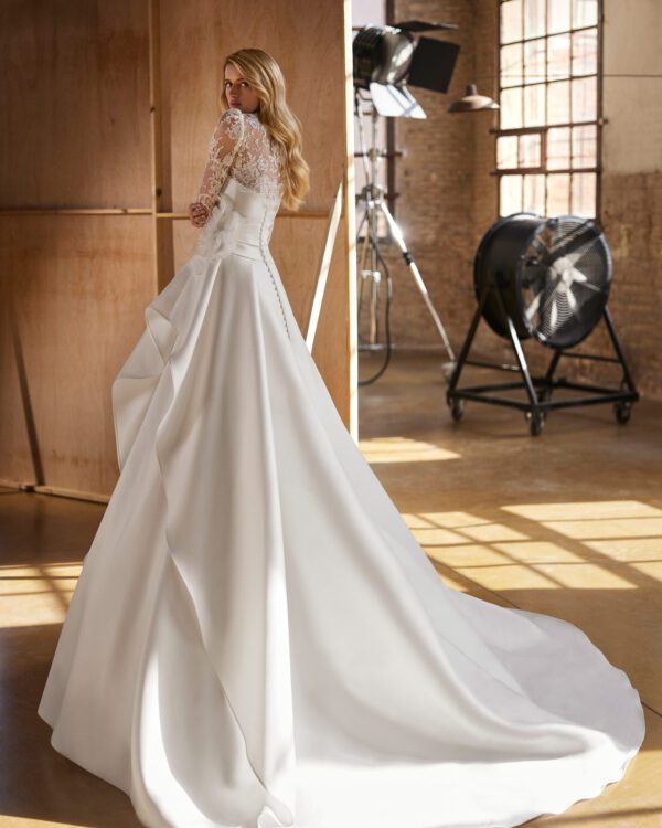 Rosa Clará Walezia Wedding Dress - Classic long two-piece ballgown-style wedding dress, made in magnolia mikado and rebrodé lace. Featuring a strapless neckline, plain, voluminous skirt, and jacket in rebrodé lace.