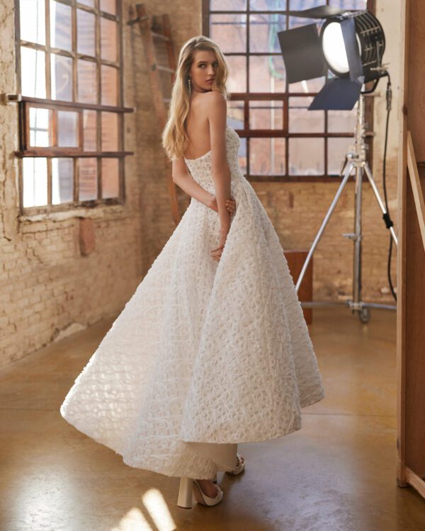 Rosa Clará Wyllow Wedding Dress - Modern midi A-line dress made in embroidered lace. Featuring a strapless neckline, zip back and a skirt with pockets.