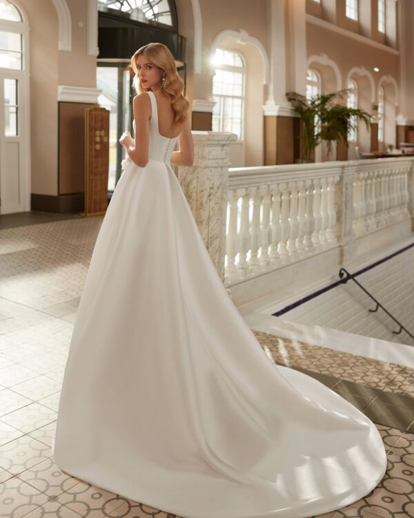 Rosa Clara Viona Wedding Dress - Classic long A-line wedding dress, crafted in mikado. Featuring a V-neckline, square back and a skirt with a front slit. An exclusive Aire Barcelona design.