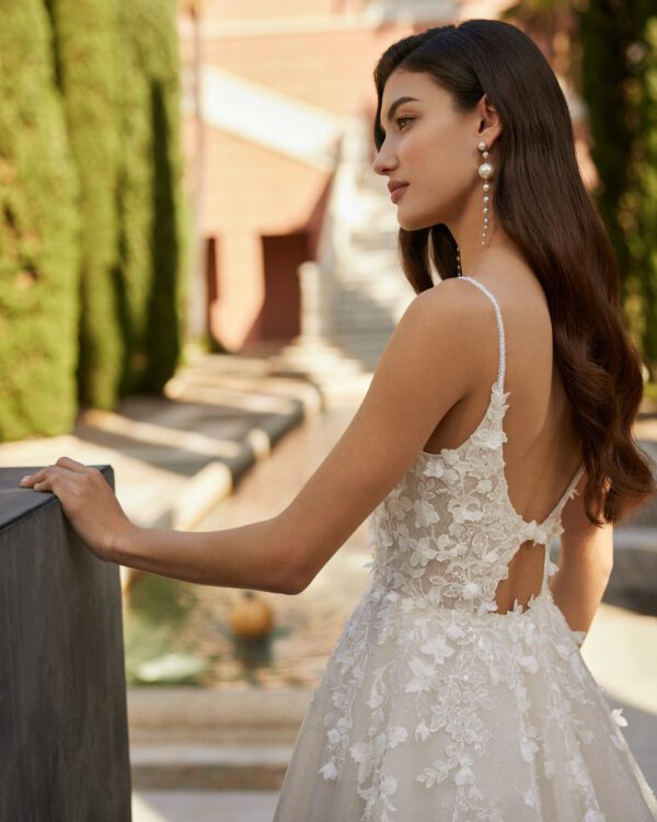 Rosa Clará Ione Wedding Dress - A-line princess wedding dress, crafted in lace combined with tulle. Featuring a plunging neckline, straps, and cut-out back.