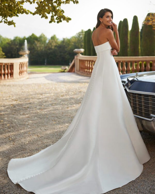 Rosa Clara Dory Wedding Dress - Two-piece A-line dress crafted in Verona mikado. Featuring a strapless neckline, and lace and beadwork bridal jacket.