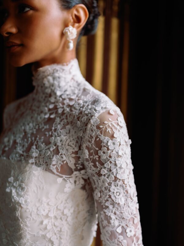 Sareh Nouri Maryanne Wedding Dress - Italian Magnolia straight edge neckline slim flare gown with seamwork detail. Shown with detachable 3D embroidered ¾ length bolero with chantilly trim.