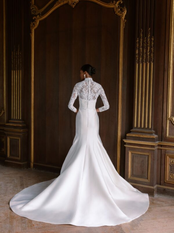 Sareh Nouri Maryanne Wedding Dress - Italian Magnolia straight edge neckline slim flare gown with seamwork detail. Shown with detachable 3D embroidered ¾ length bolero with chantilly trim.