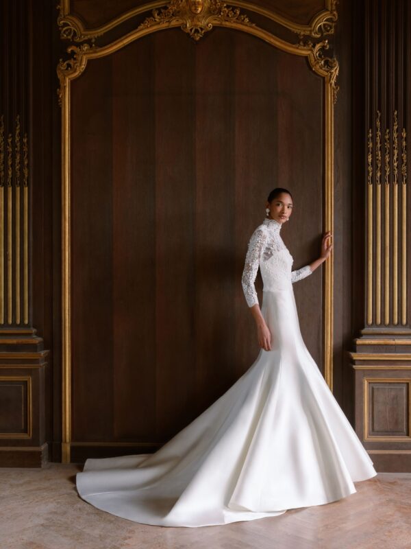 Sareh Nouri Maryanne Wedding Dress - Italian Magnolia straight edge neckline slim flare gown with seamwork detail. Shown with detachable 3D embroidered ¾ length bolero with chantilly trim.