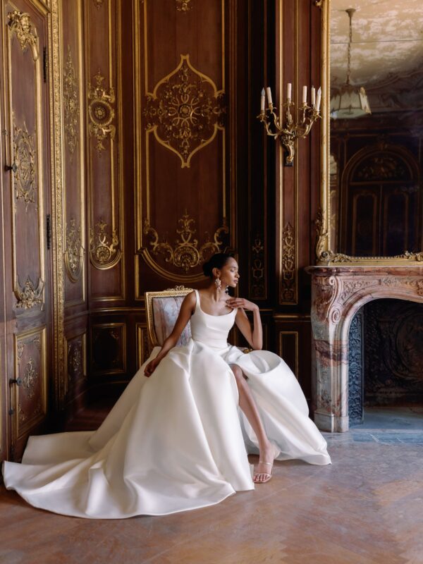 Sareh Nouri Philippa Wedding Dress - Italian Stretch Mikado scoop neck hand draped high slit ball gown with cathedral train and low back twist detail.
