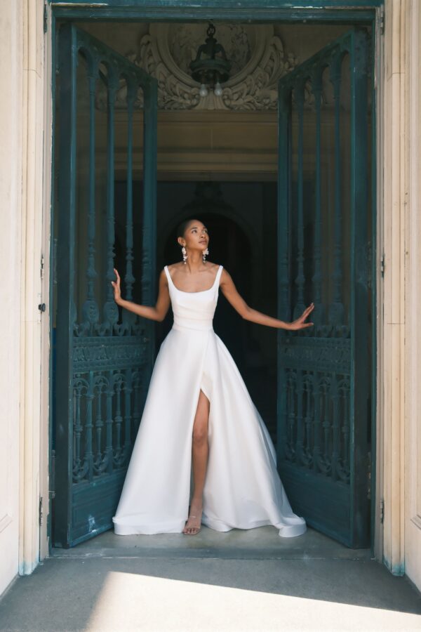Sareh Nouri Philippa Wedding Dress - Italian Stretch Mikado scoop neck hand draped high slit ball gown with cathedral train and low back twist detail.