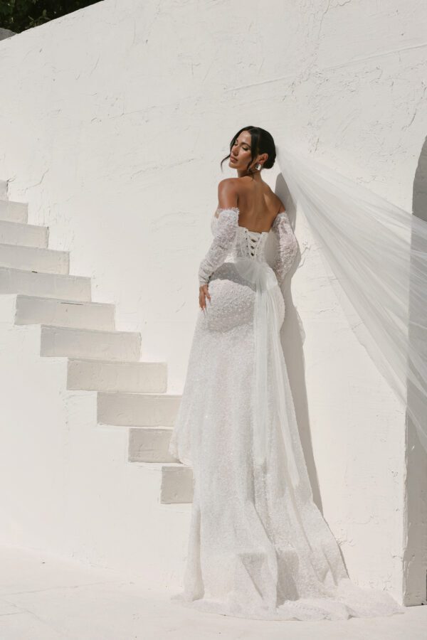 Martina Liana 1860 Wedding Dress - Fit and flare style with detachable long sleeves, sweetheart neckline, exposed boning, 3D Floral, and pearl embellishment