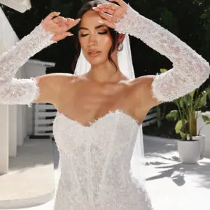 Martina Liana 1860 Wedding Dress - Fit and flare style with detachable long sleeves, sweetheart neckline, exposed boning, 3D Floral, and pearl embellishment