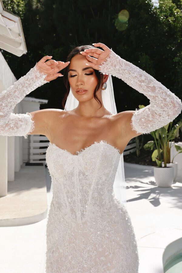 Martina Liana 1860 Wedding Dress - Fit and flare style with detachable long sleeves, sweetheart neckline, exposed boning, 3D Floral, and pearl embellishment