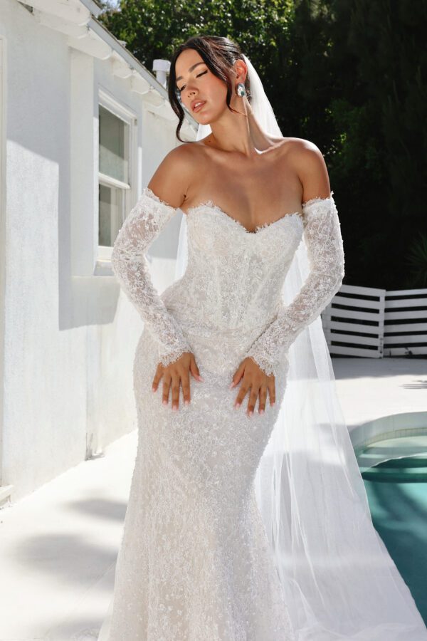 Martina Liana 1860 Wedding Dress - Fit and flare style with detachable long sleeves, sweetheart neckline, exposed boning, 3D Floral, and pearl embellishment