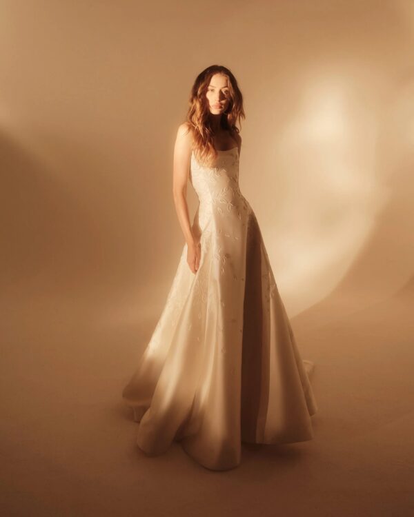 Enaura Celine Wedding Dress - A-Line style dress with cat eye sweetheart neckline, all over embroidery, structured fitted silhouette. 