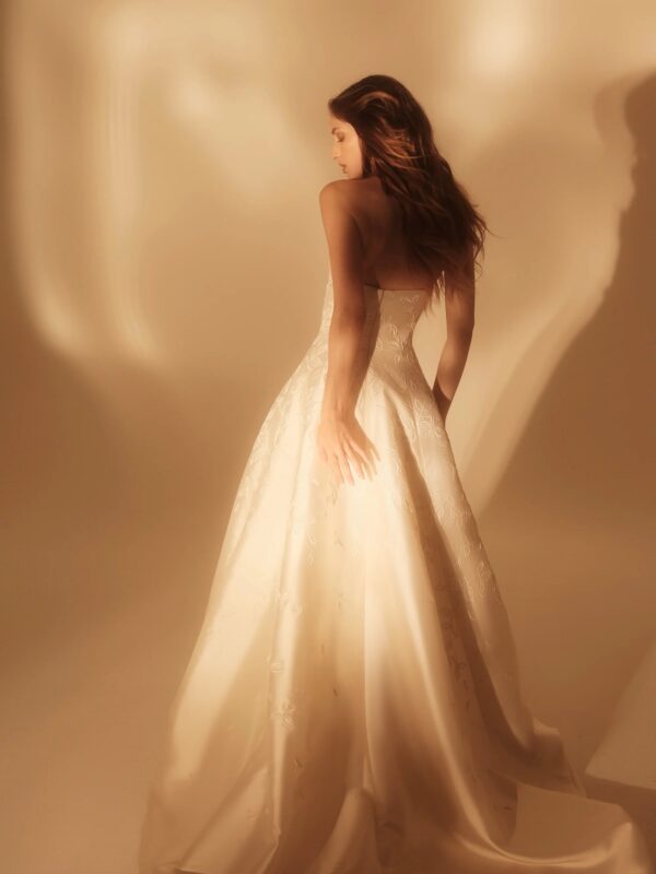 Enaura Celine Wedding Dress - A-Line style dress with cat eye sweetheart neckline, all over embroidery, structured fitted silhouette. 