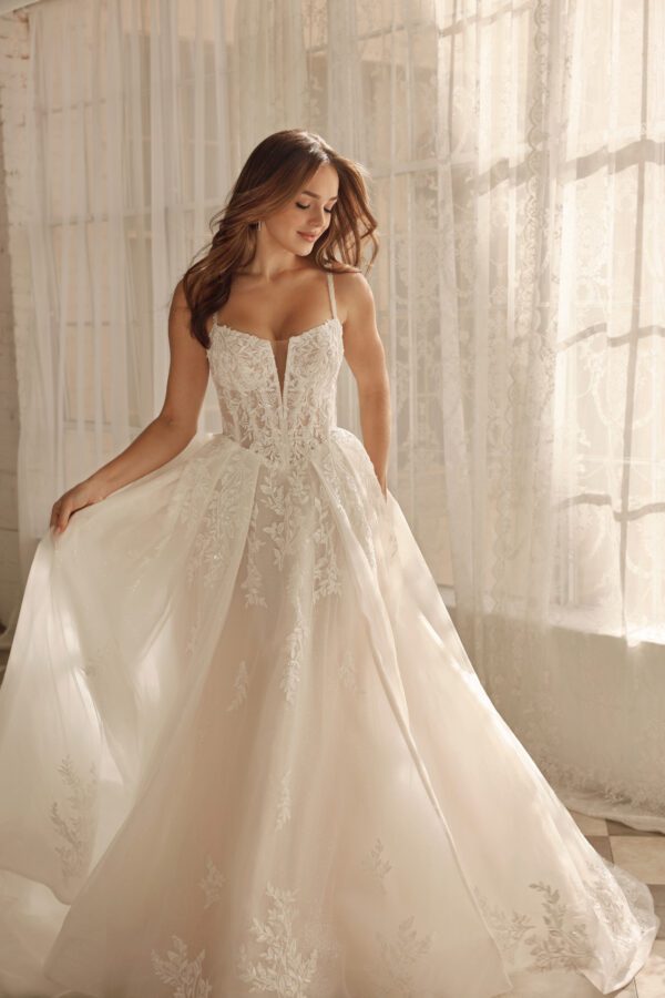 Martina Liana 1833 Wedding Dress - A-Line style with voluminous skirt, sweetheart neckline, spaghetti straps, corset bodice, floral lace and, tulle skirt.