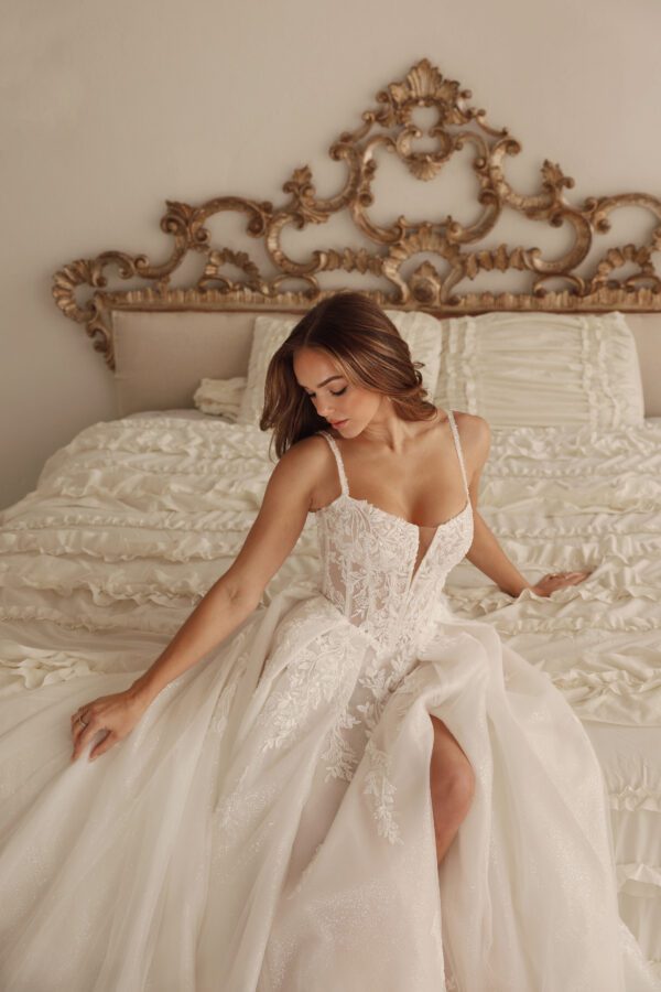 Martina Liana 1833 Wedding Dress - A-Line style with voluminous skirt, sweetheart neckline, spaghetti straps, corset bodice, floral lace and, tulle skirt.