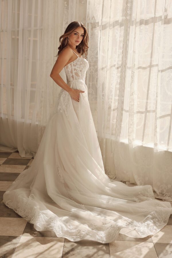 Martina Liana 1833 Wedding Dress - A-Line style with voluminous skirt, sweetheart neckline, spaghetti straps, corset bodice, floral lace and, tulle skirt.
