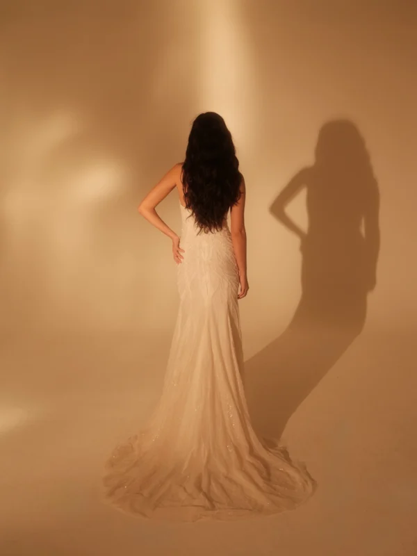 Enaura Seine Wedding Dress - Fit and flare style dress with a striking cat-eye deep sweetheart neckline, all-over beadwork and threadwork.
