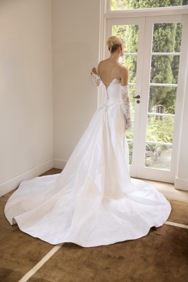 La Premiere Bobbi Wedding Dress - Fit and flare modern-classic dress with Basque waist, petal shaped neckline, detachable train and sleeves. 