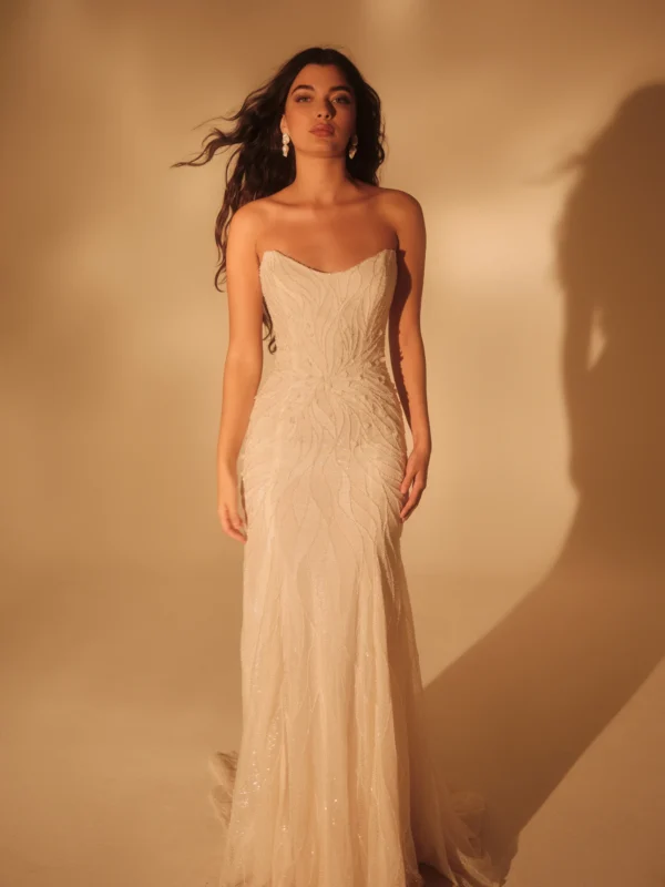 Enaura Seine Wedding Dress - Fit and flare style dress with a striking cat-eye deep sweetheart neckline, all-over beadwork and threadwork.